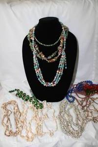 lot 521 image: Assorted fashion necklaces. Includes a selection of shell necklaces.