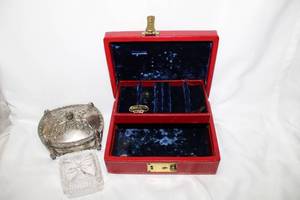 lot 523 image: (3) jewelry boxes Vintage Mele leather jewelry box w 2 keys & 24K gold leather tooling7.5L x 6D x 3H, a silver plate lidded jewelry casket w acorn finial handle, velvet interior 5W x 4D x 3H. Also a pressed glass lidded box2.5W x 2H.