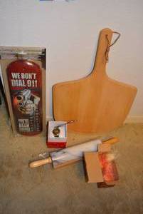 lot 57 image: Wooden Pizza Peel, Themometer, Marble Rolling Pin, and Christmas Watch