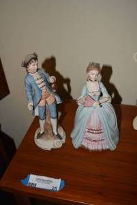 lot 25 image: Boy and Girl Enesco Figurines