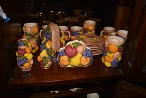 lot 141 image: Fruit design plate and mug set with napkin holder, S&P, cream and sugar, candle holders and more