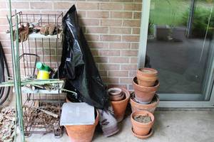 lot 393 image: Terra Cotta Pots and Garden Tools as shown