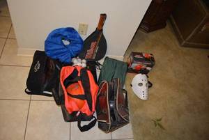 lot 69 image: Sports Lot Bowling Balls, Golf Shoes (Size 11W  and 10.5W), Racketball Racket, Boxing Glove and More