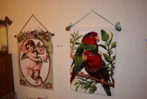 lot 352 image: 2 Hanging Latch Rugs One with Birds, One with Cherub, Each 3 Foot Tall