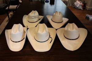 lot 26 image: Straw Cowboy Hats Resistol 100X Size 7 38, Paramount 10X Size 7 14,  and George Strait 8X