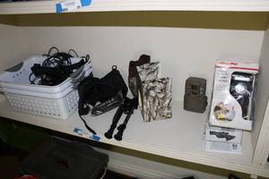 lot 86 image: Misc. Hunting Items DC to AC Power Center, Camo Camera and 2 Small Bipod Stands