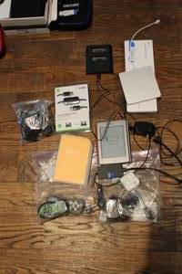 lot 109 image: Two Kindles, Belkin Transfer Cable, ExtremeMac Incharge Duo