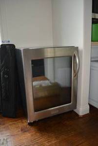 lot 283 image: KitchenAid Wine Refrigerator, Model KURG24LWBS21, CONTENTS NOT INCLUDED
