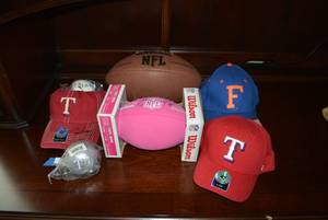 lot 317 image: Sports Souvenirs Rangers Hat and Baseball Signed Ivan Rodriguez Pudge #7 and More