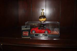 lot 314 image: Ferrari Model Car - 458 Spider, Ronald Reagan pin It Can Be Done, and Alaska Gold Souvenir