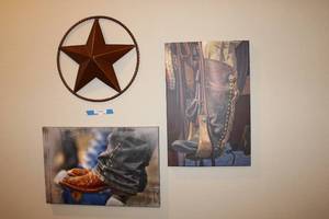 lot 339 image: Boots and Star Wall Art Two Wrapped Canvas Prints (One signed Joan Carroll 225 2011) and Metal Star