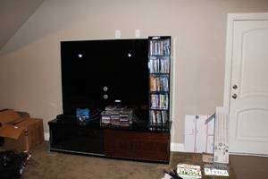 lot 528 image: Entertainment Stand with Sliding Bottom Doors and DVD Storage Shelves, CONTENTS NOT INCLUDED