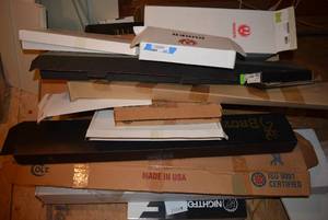 lot 437 image: Large lot of shipping boxes for guns many still have accessories in them and paperwork. MUST TAKE ENTIRE LOT ALL BOXES MUST GO