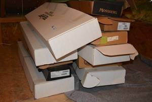 lot 441 image: Large lot of shipping boxes for guns many still have accessories in them and paperwork. MUST TAKE ENTIRE LOT ALL BOXES MUST GO