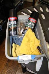 lot 591 image: Gun Oil Cans and Cleaning Cloths