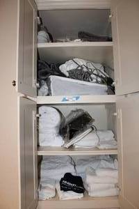 lot 232 image: Contents of Cabinet Includes Towels, Heating Pad and Heated Blanket