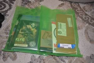 lot 598 image: Gun Accessories REPR User Manual, 3 Piece REPR Rail Kit gun oil and misc