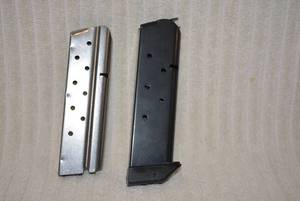 lot 697 image: $5 Cal Clip and rail 1911 style has J&J on bottom PREVIEW RECCOMMENDED