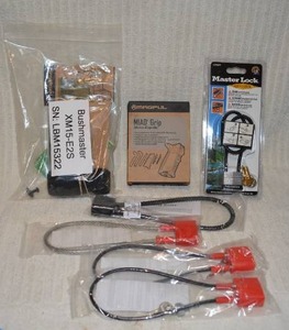 lot 700 image: Bushmaster Accessories bag grip kit and 5 gun locks in bags