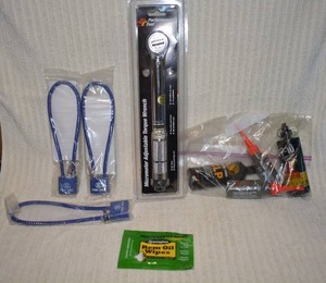 lot 708 image: Gun locks, torch wrench, and gun cleaning oils and supplies  PREVIEW RECCOMMENDED