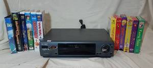 lot 289 image: Sharp VCR w 12 VHS Movies