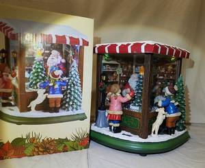 lot 449 image: Musical LED Santas Toy Shop