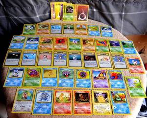 lot 159 image: 1999 POKEMON FOSSIL SET CARDS - 48 OF 62 CARD SET INCLUDING PICAHU, CHARMANDER, & FOIL STAMPED KABUTO