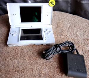 lot 186 image: NINTENDO DS2 LITE GAMING SYSTEM WITH POWER CORD
