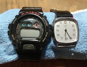 lot 120 image: Two mens watches a G-Shock DW6900 and a Timex that needs a wrist band and both need batteries. (One Money)
