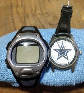 lot 121 image: Two mens watches, A Sportline and Dallas Cowboy design that needs a wrist band and also both need batteries. (One Money)