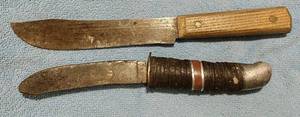 lot 128 image: Two knives one with a wooden handle total length 11.5 inches, one with a leather ring handle, total length 9.5 inches, (One Money)