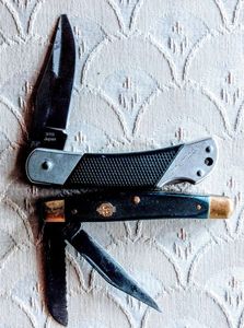 lot 134 image: Two Pocket Knives, Kershaw Corel Creek Pocket knife, tip is broken, A Copenhagen Schrade pocket knife, (One Money)