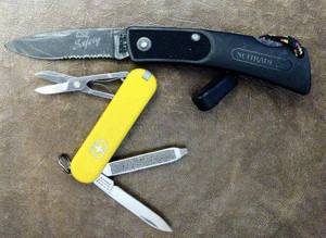 lot 140 image: Two pocket knives a Schrade SP2 lockblade 5.25 inches in total length and a Victorinox, (One Money)