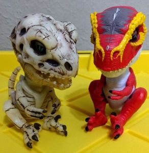 lot 209 image: Two 2017 WOWWEE Untamed Fingerling Raptor Dinosaurs Approximately 4.5 tall (One Money)