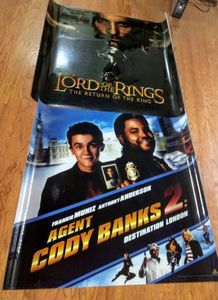 lot 231 image: 2 movie posters printed on plastic film, 45.5 L x 40.5 Tall, Agent Cody and The Lord of the Rings, (2 x money)