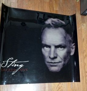 lot 232 image: Movie poster printed on plastic film, 45.5 L x 40.5 Tall, Sting Sacred Love