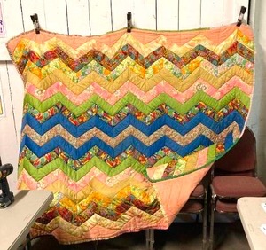 lot 1 image: Quilts (2) - 1st approx 78 Chevron pattern  second 104 older circle design