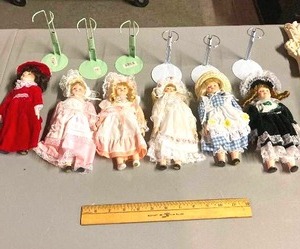 lot 72 image: group of 6 ceramic dolls with stands