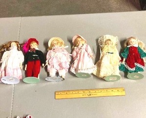 lot 73 image: group of 6 ceramic dolls with stands