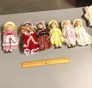 lot 74 image: group of 6 ceramic dolls with stands