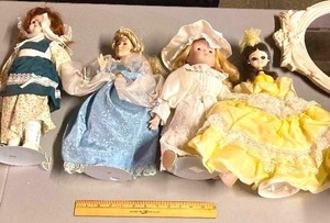 lot 78 image: 4 dolls with stands far right doll is plastic