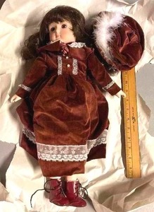 lot 79 image: Large Doll with hat and shoes