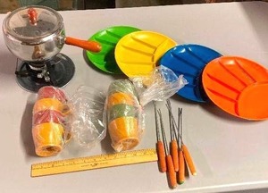 lot 94 image: Fondue hosting set right out of the 70s. Metal fondue pot with forks and multicolored sampling dishes
