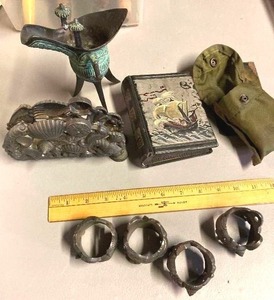 lot 151 image: Explorers lot - Cast Metal Seashell napkin rings and holder, small Asian ceremonial pitcher, small antique tintype photo album &amp gaminga ()compass