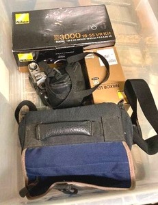 lot 168 image: Camera CollectionThe Nikon D3000 looks like it is new in boxSony Video CameraPentax, Sony and Canon Cameras