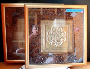 lot 40 image: ORNATE TIN TILES FRAMED UNDER GLASS - MATCHING PAIR MEASURE 24 X 24