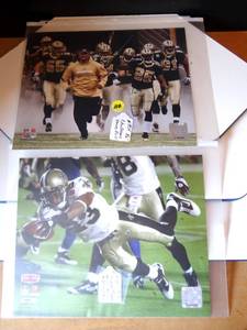 lot 110 image: NEW ORLEANS SAINTS 8 X 10 PHOTOS - PIERRE THOMAS AND TEAM SHOT WITH REGGIE BUSH