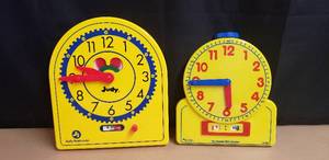 lot 11 image: Lot of 2 Geared Teacher Clocks - 1 Judy Clock and 1 Larning Resources The Primary Time Teacher Clock