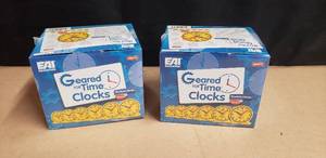 lot 13 image: Lot of 2 Boxes of New EAI Education Geared for Time Student Clocks - 6 Per Box, 12 Total Clocks
