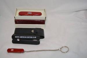 lot 278 image: Swiss Army Knife with Long Keychain, North American Hunting Club Multitool, and Marlboro Swiss Army Knife